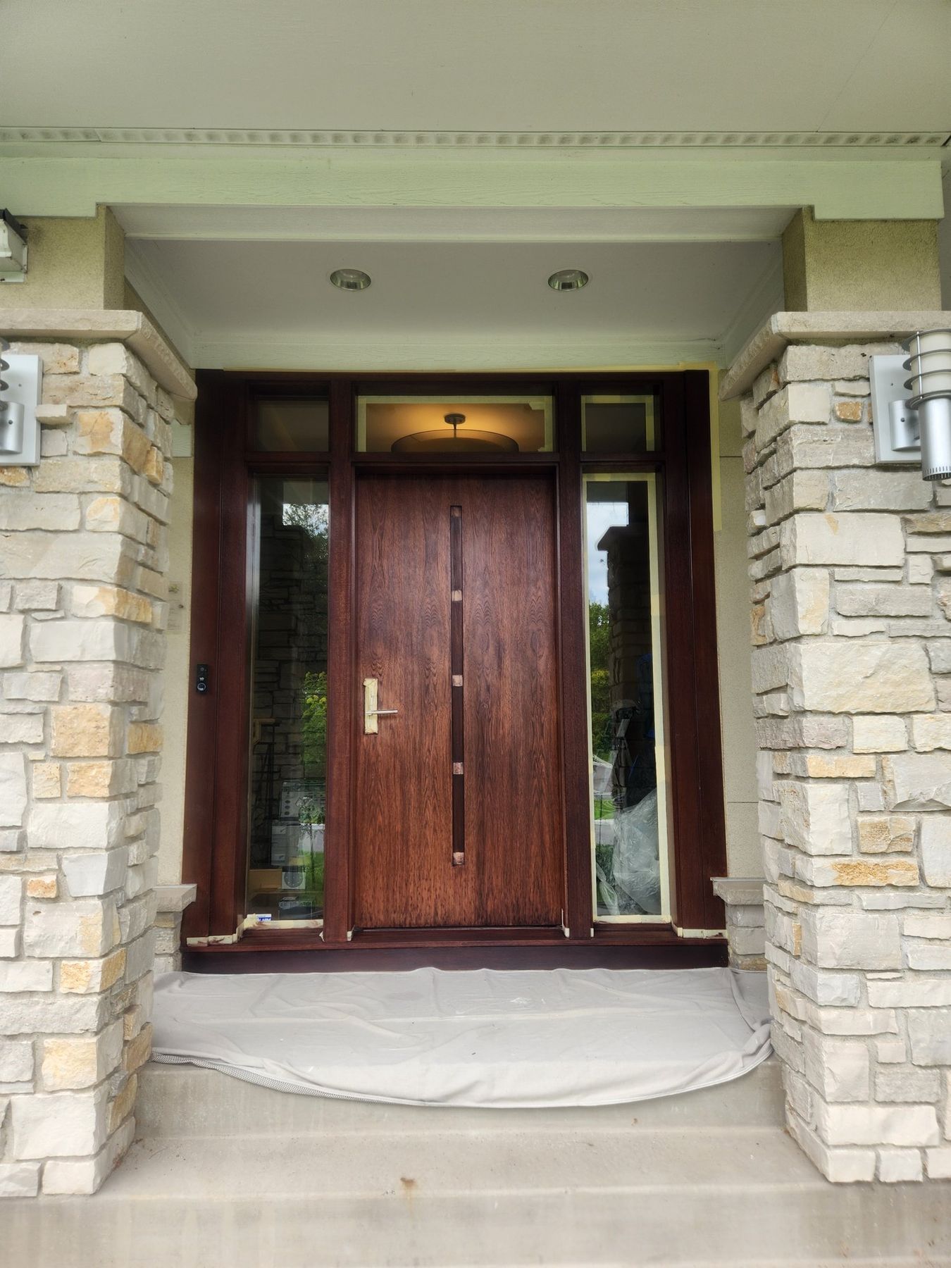 Entry door and sidelights restained