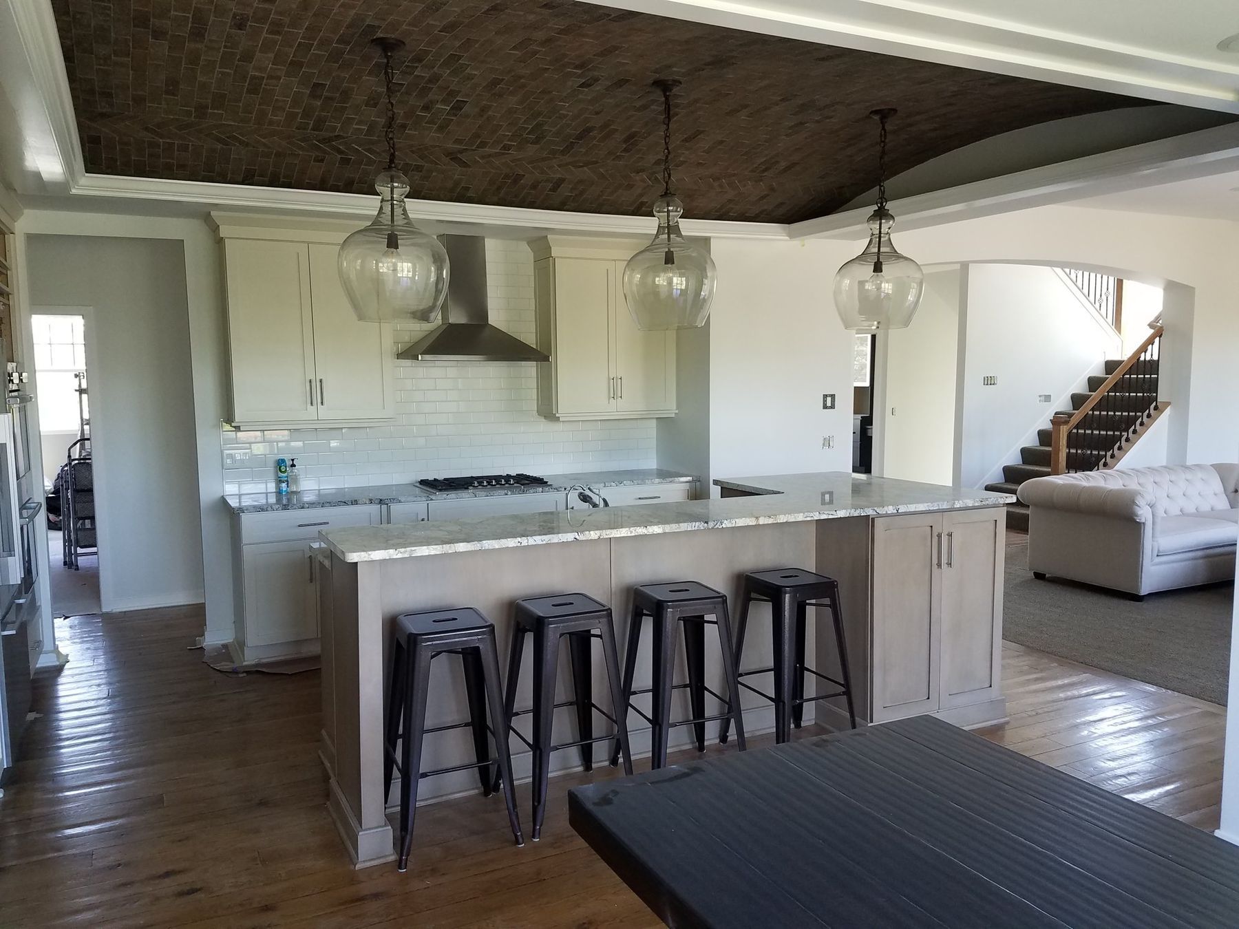 Kitchen and great room walls skim-coated smooth and painted white