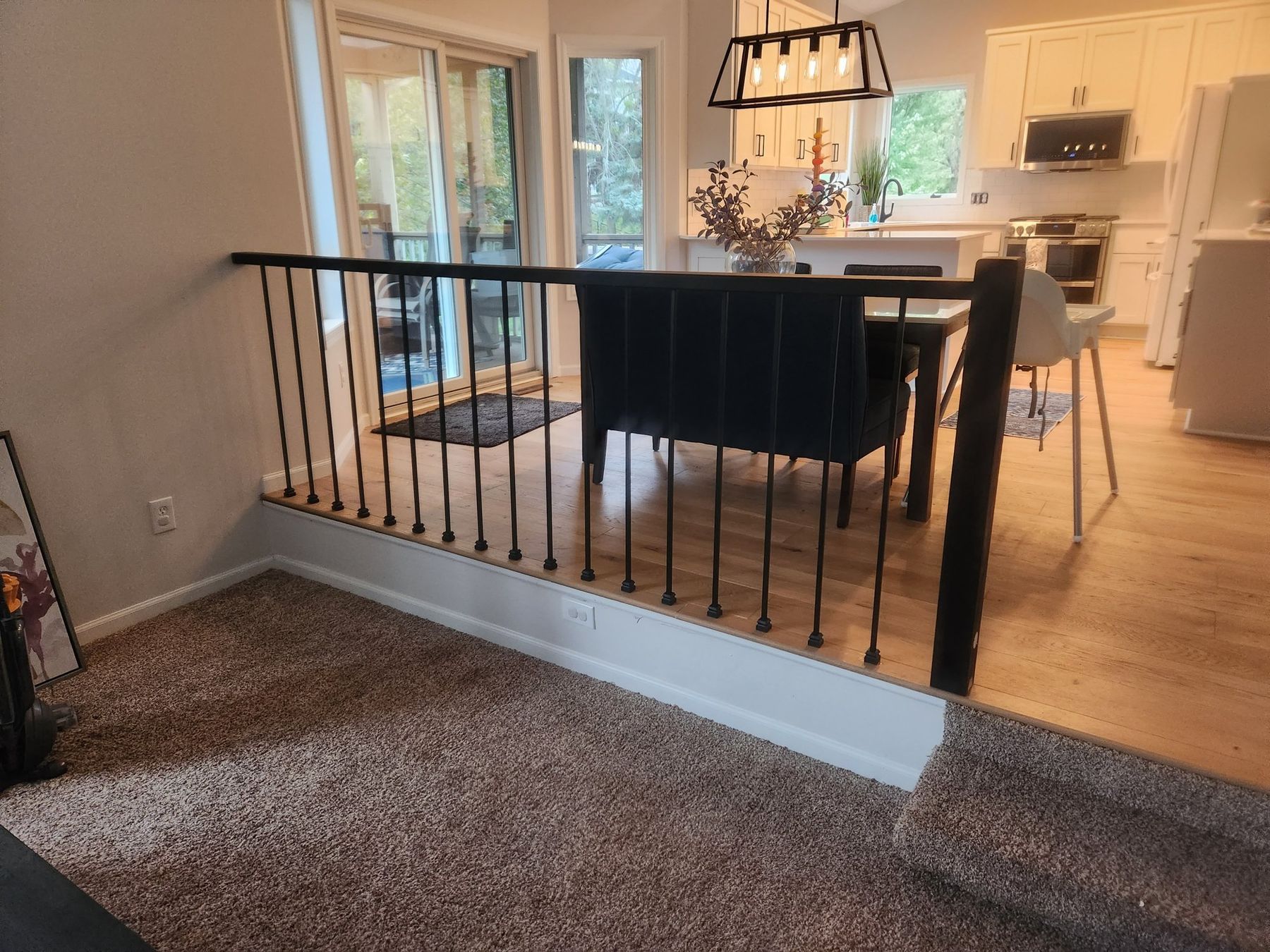 Dining area with white-painted casings, baseboard and knee wall