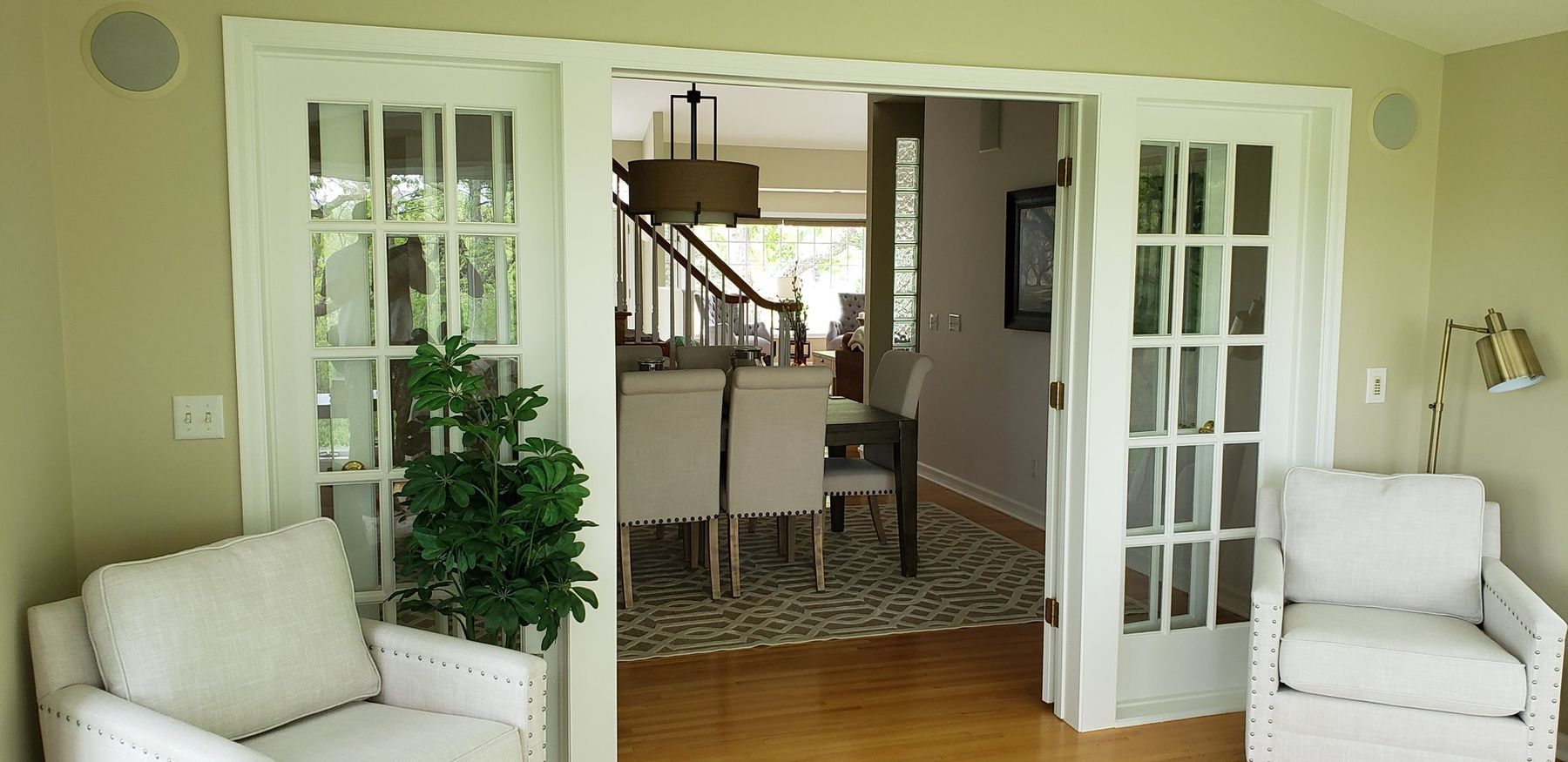 French doors between the living and dining rooms, painted white