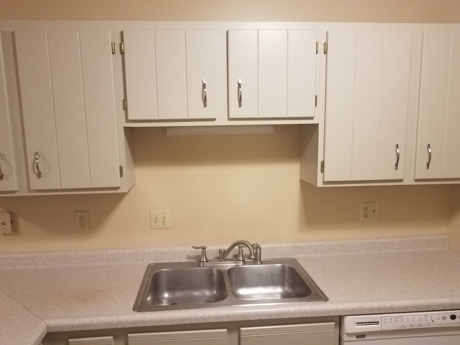 Upper cabinets painted off-white