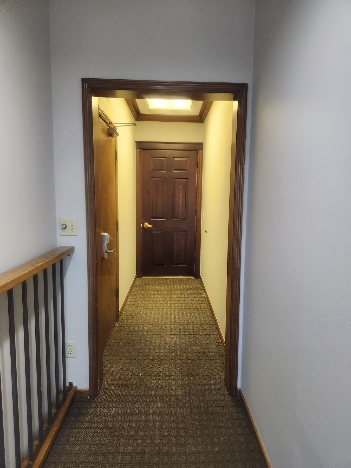 Hallway repainted after striped wallpaper was removed