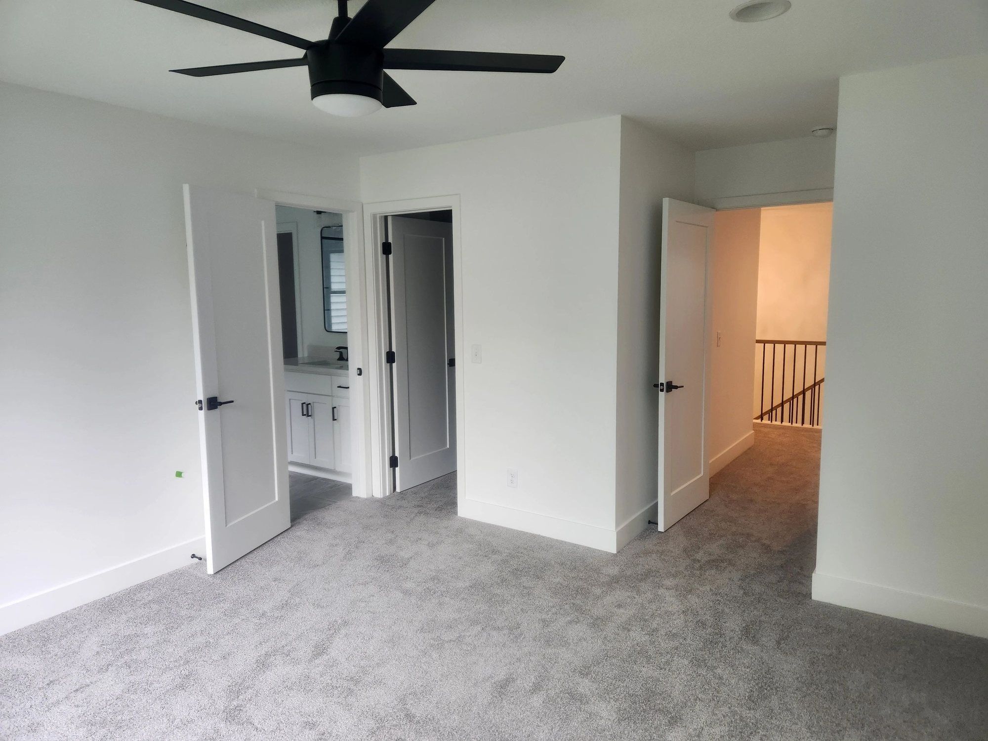 Bedroom and hallway with smooth painted ceilings