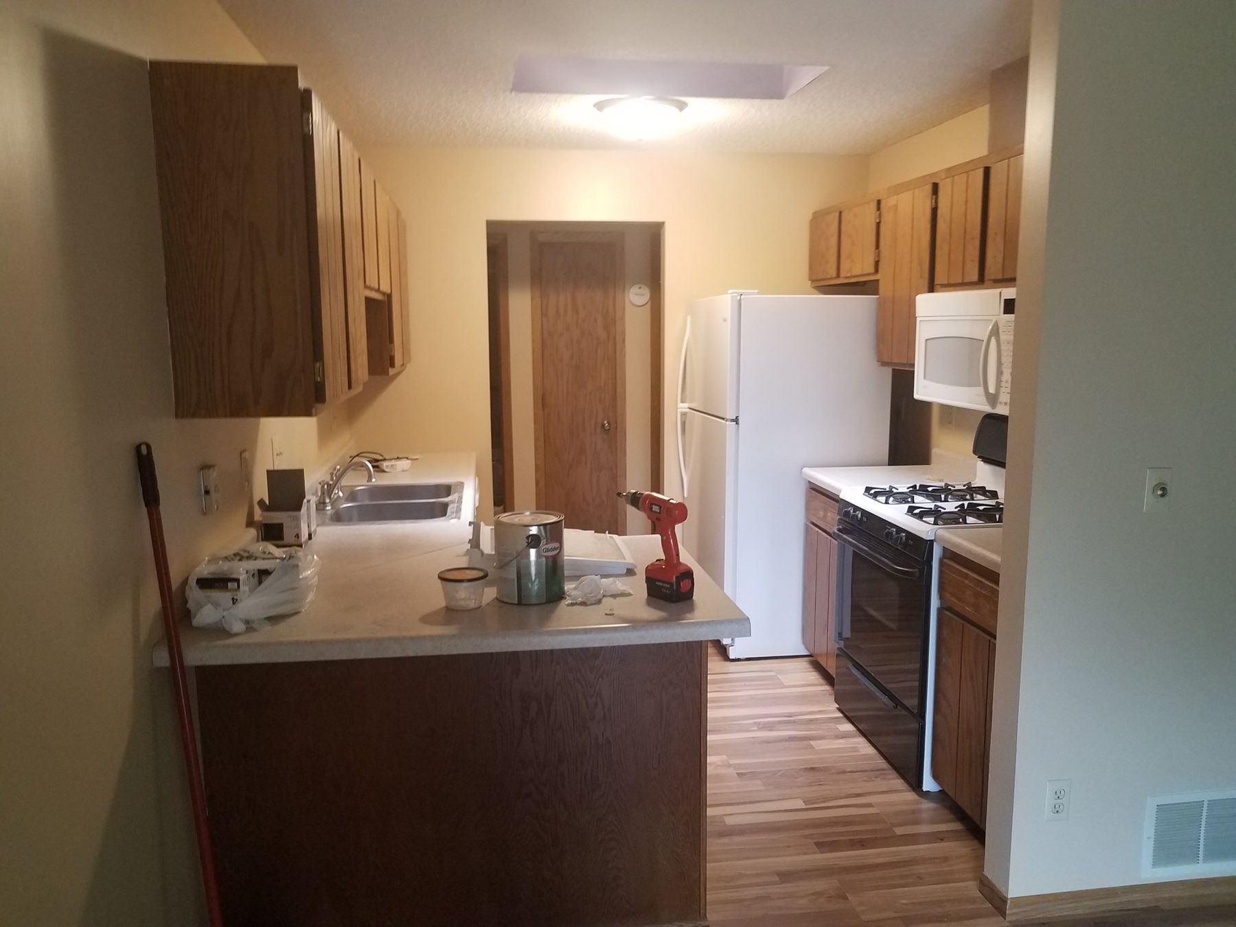 Before: golden oak cabinets and peninsula