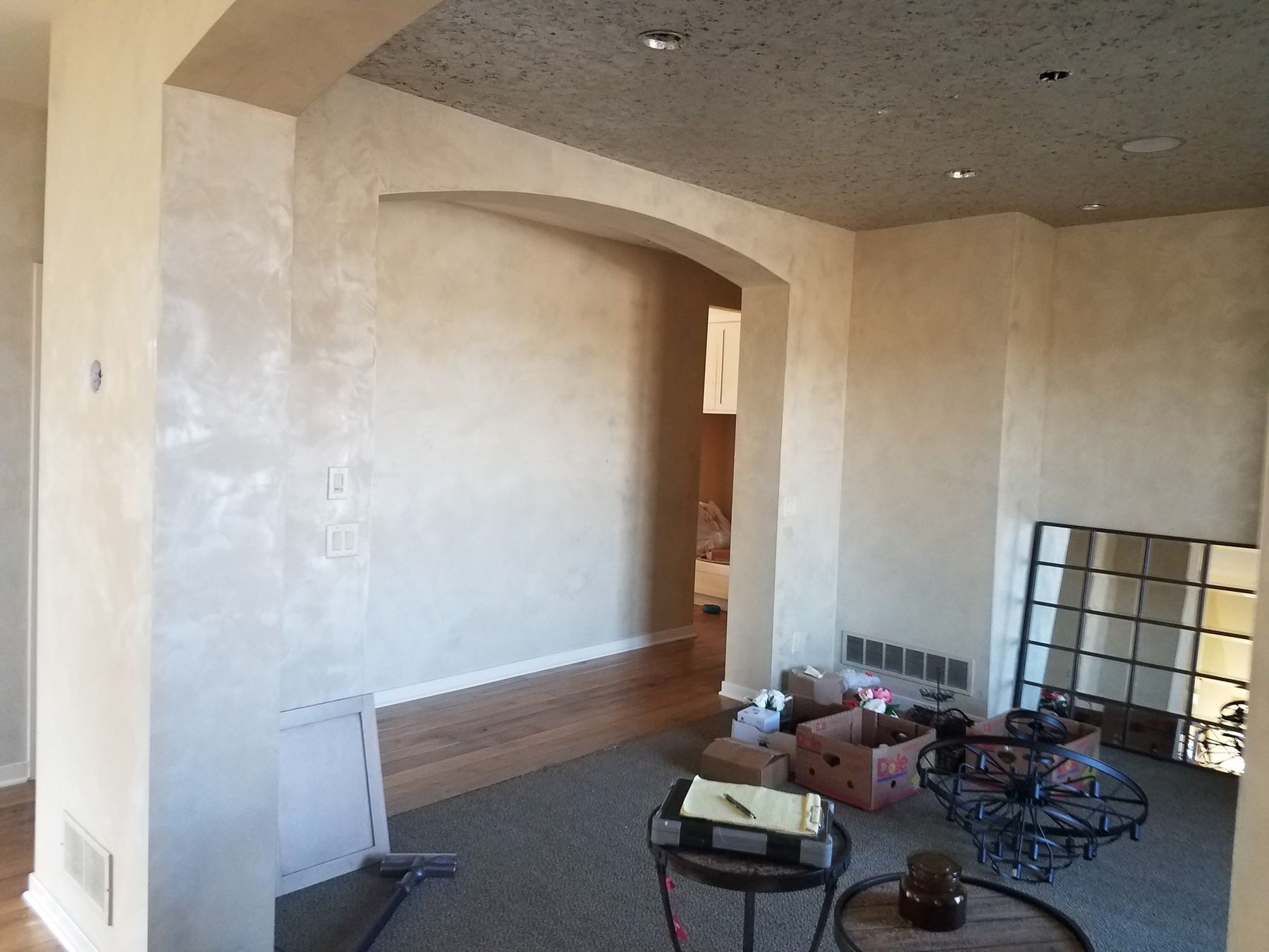 Before: textured faux-finish walls and arches