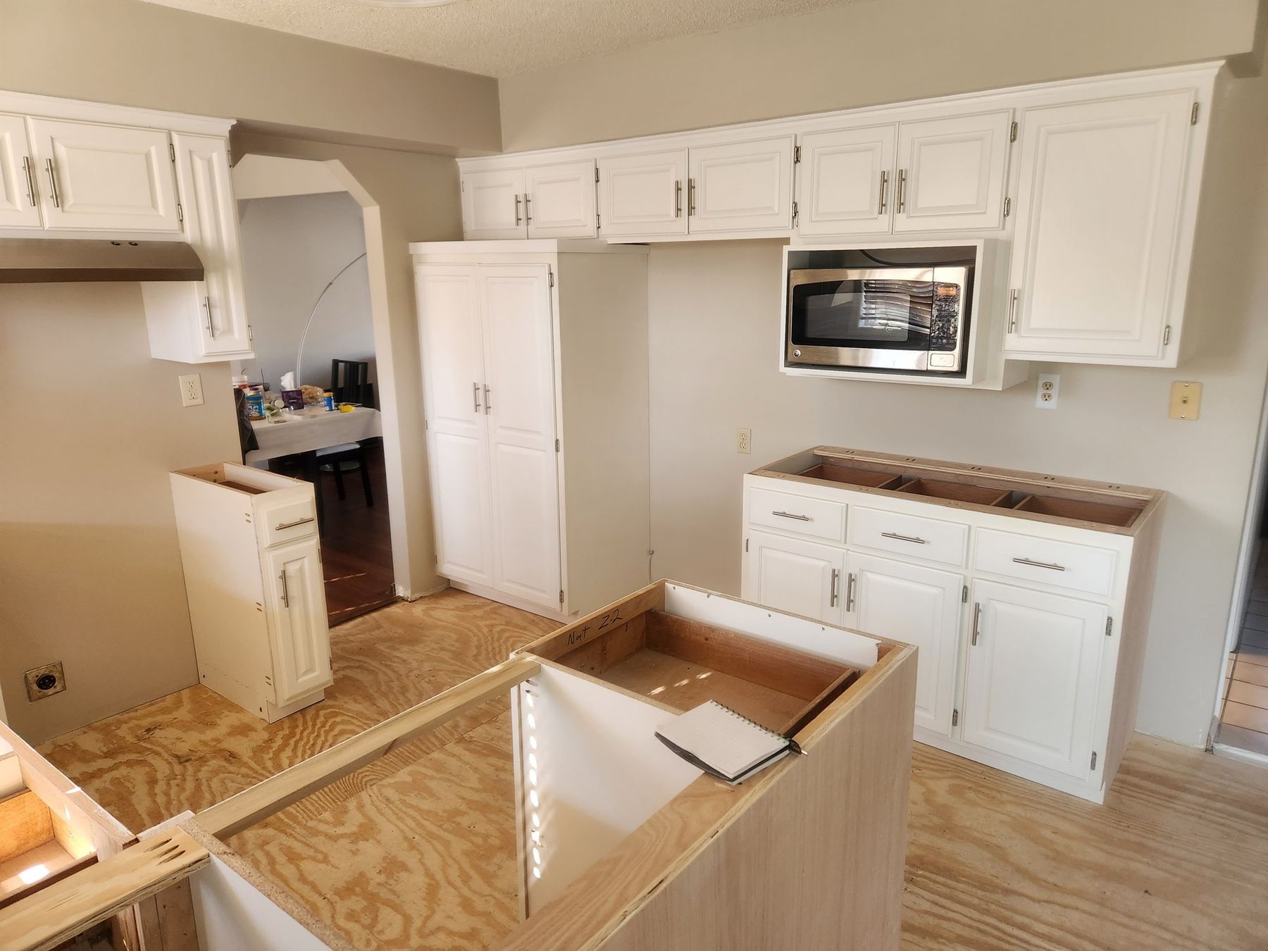 Before: existing painted cabinets and new unfinished island panels