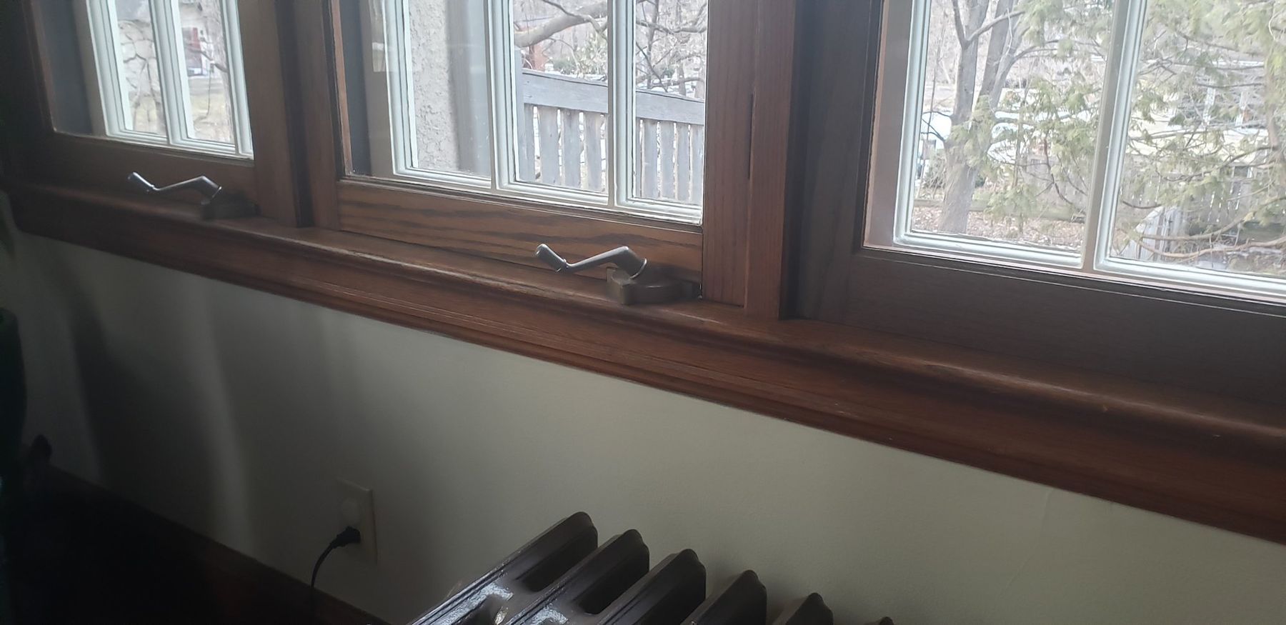 Before: worn finish on the window sashes