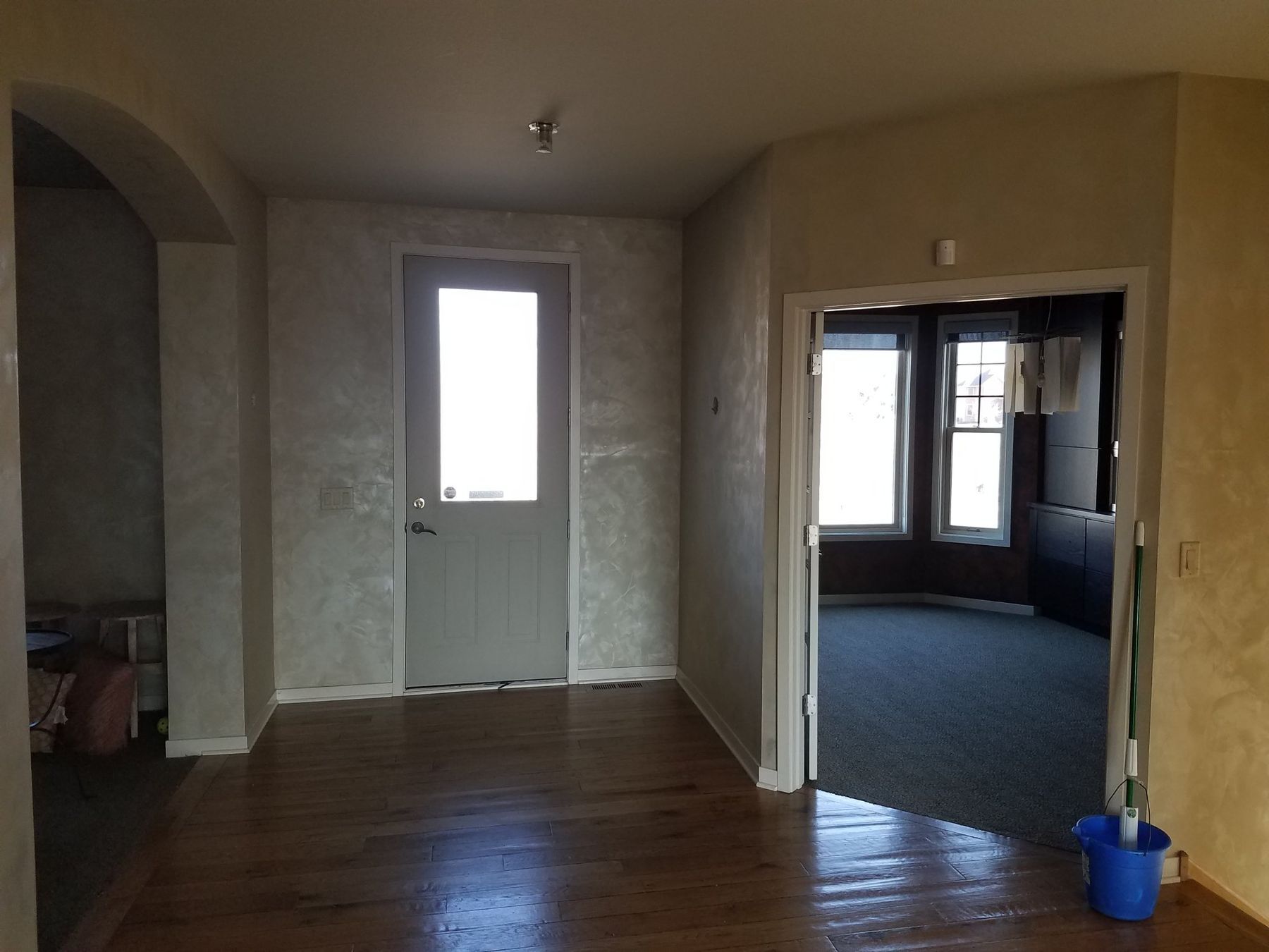 Before: faux-finish walls in the entry