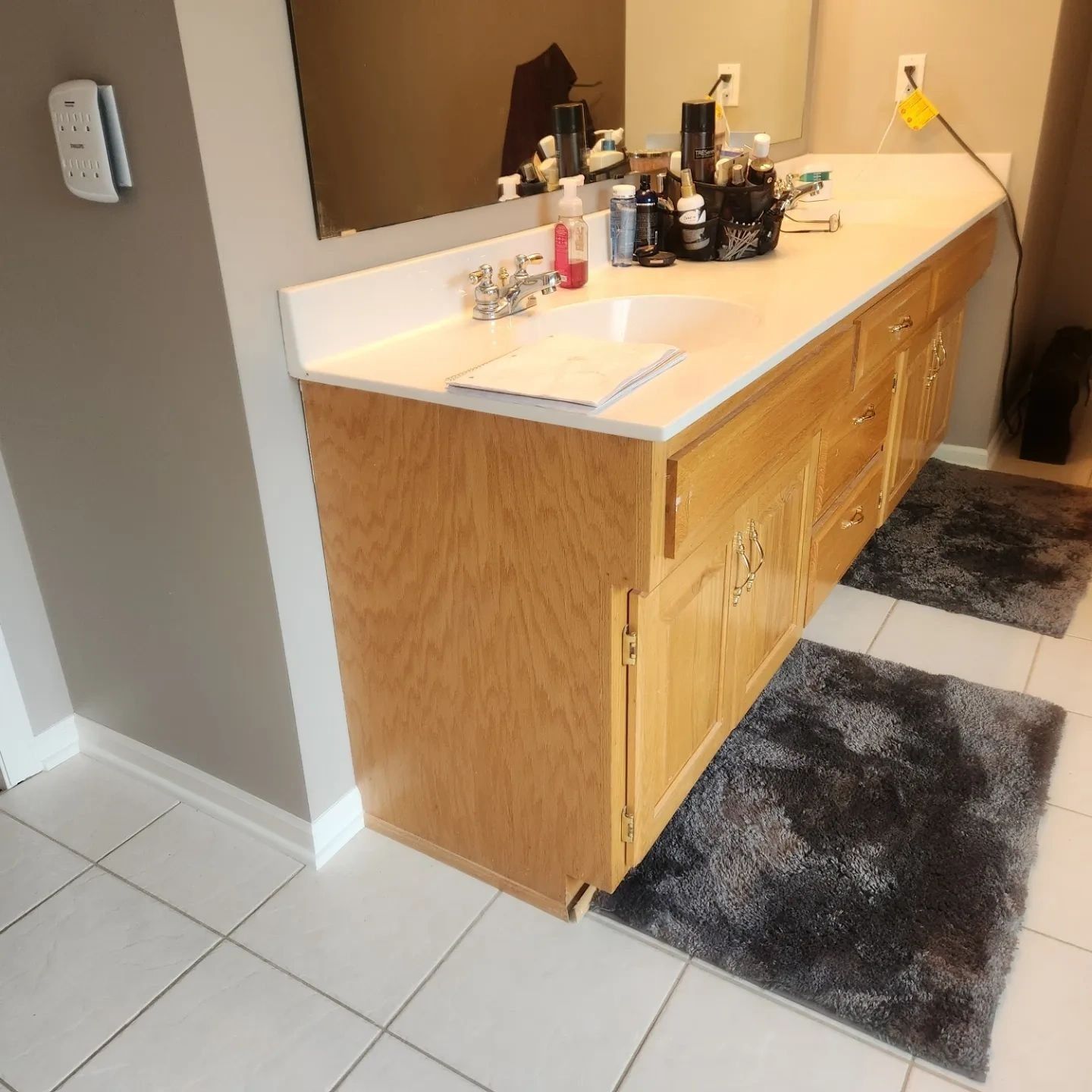 Golden oak bathroom vanity before painting