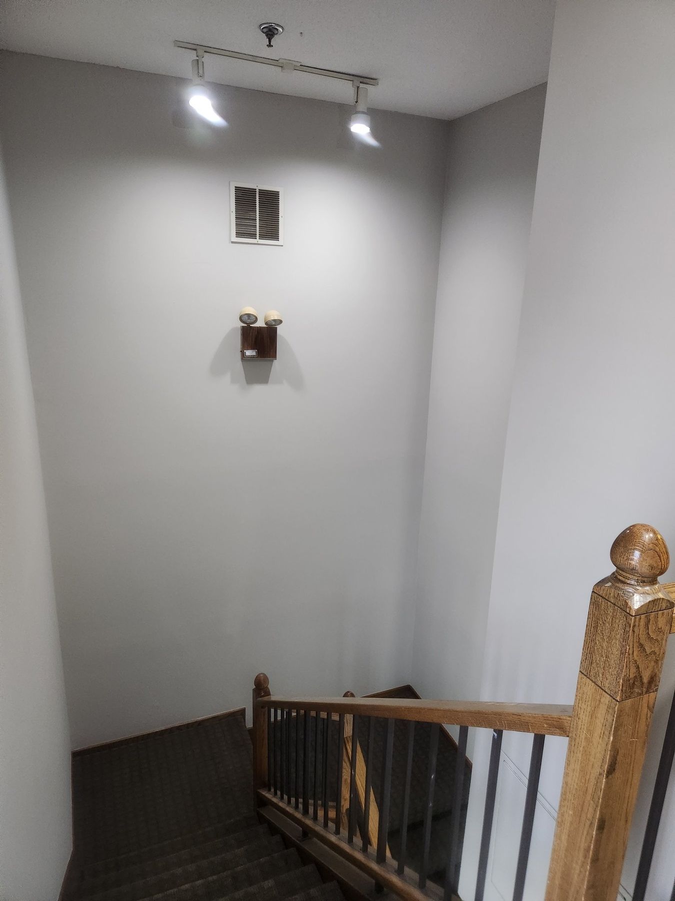 After: Stairwell: water-streaked walls repaired, primed and repainted
