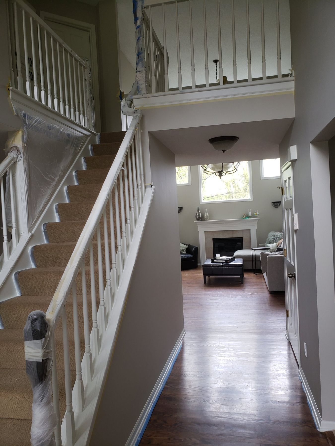 Before: Staircase and landing: golden oak rails to espresso with white balusters