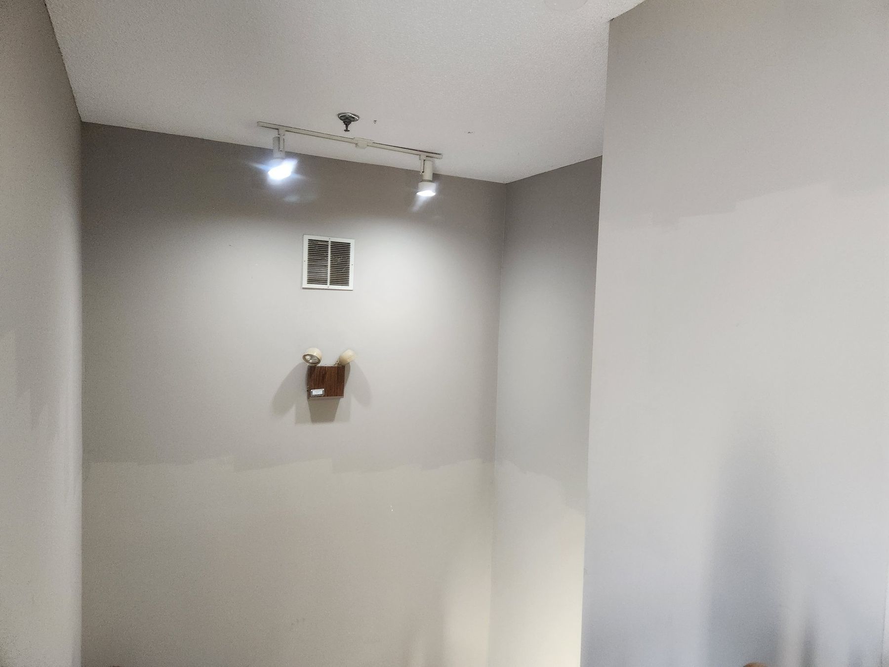 Before: Stairwell: water-streaked walls repaired, primed and repainted