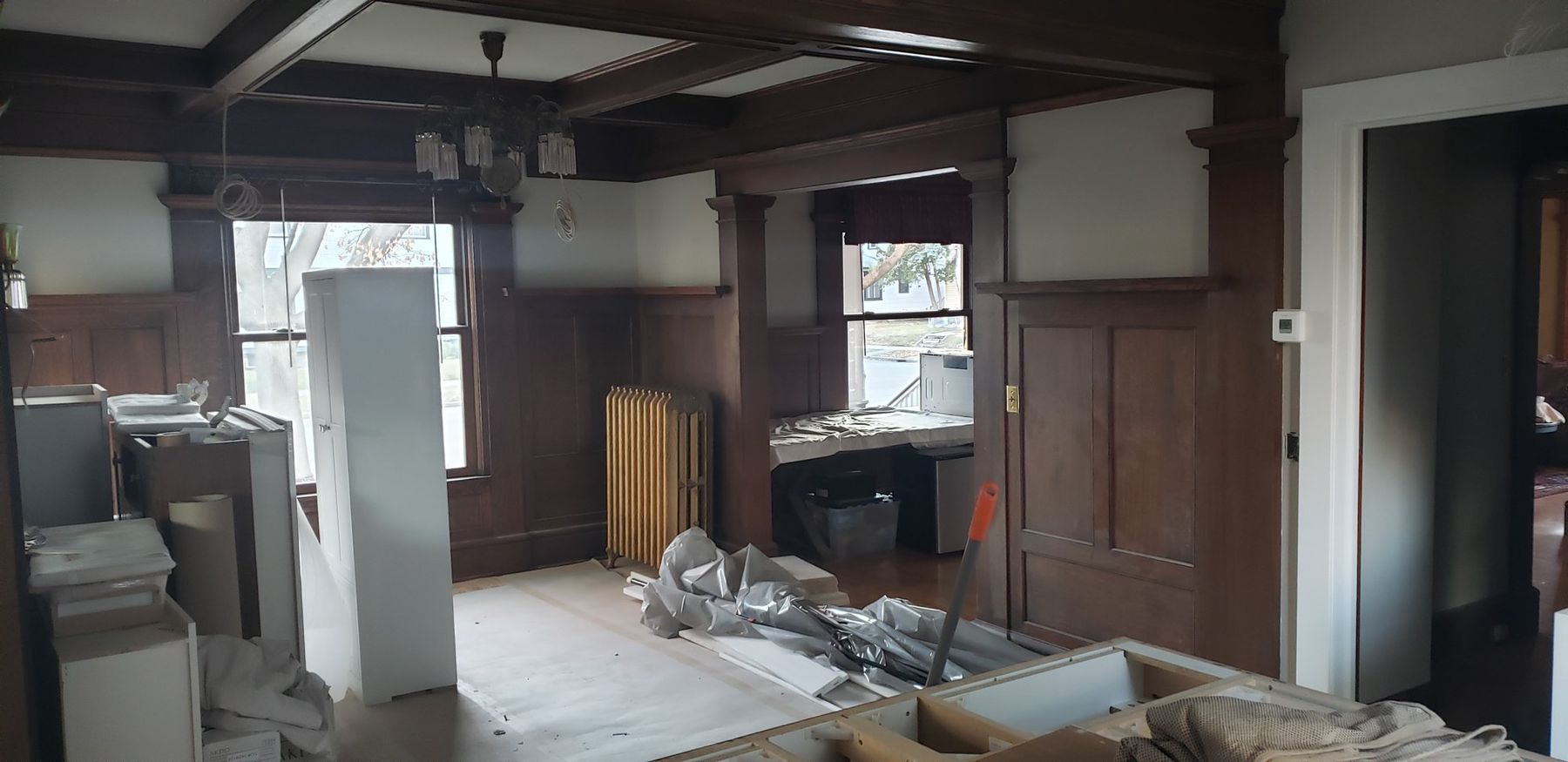 Before: Dining room: remodel in progress to finished, original woodwork kept