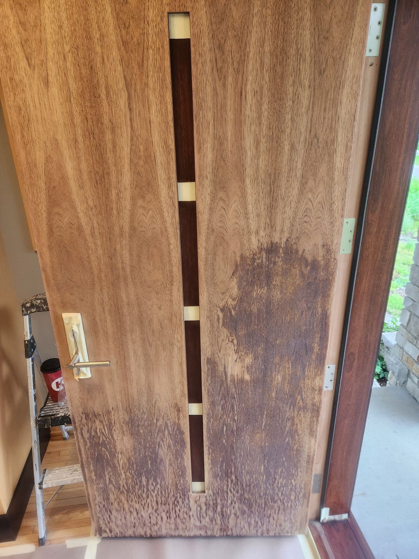 Door stripped back to bare wood