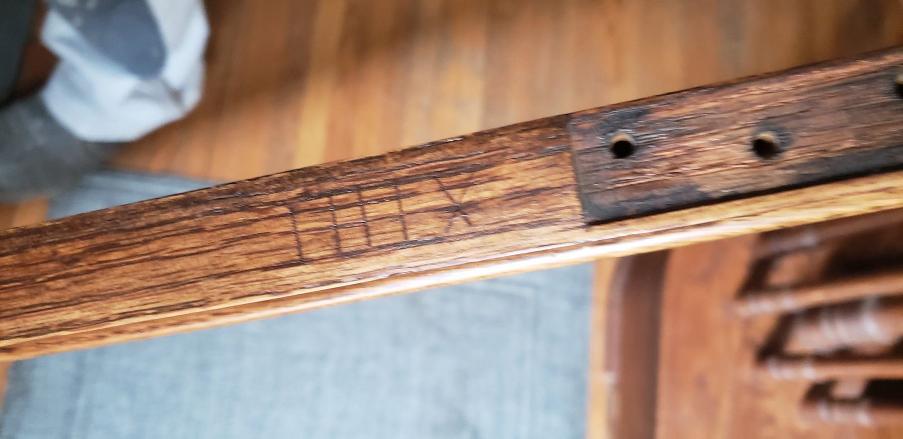 Roman-numeral marking cut into a sash to match it to its opening