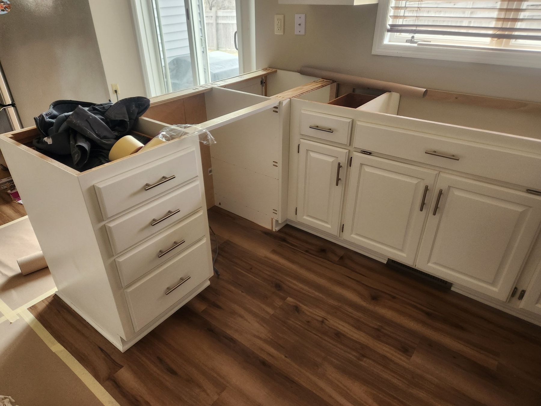 Cabinet boxes prepped after new flooring went in
