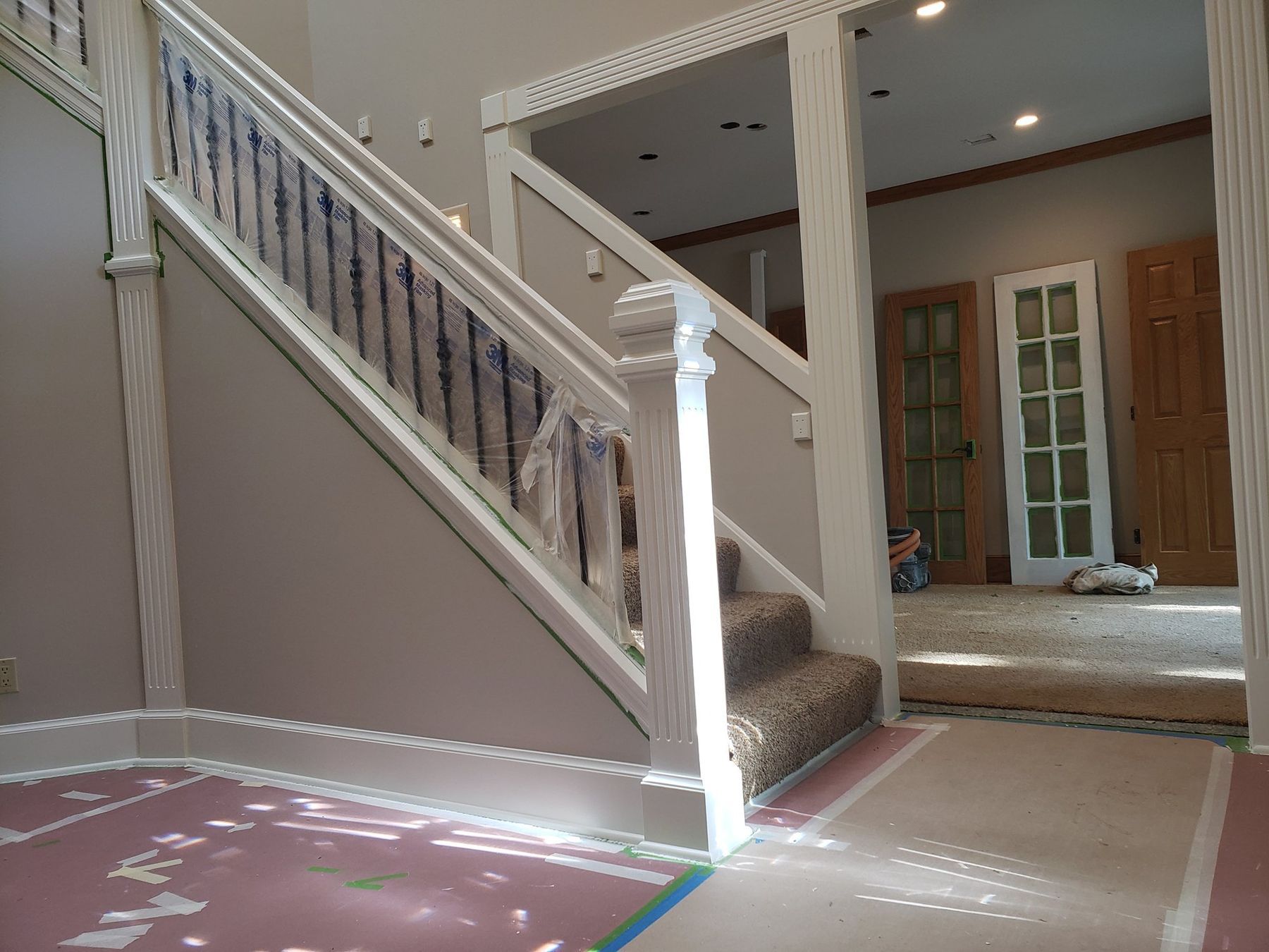 Staircase spindles and skirt primed, floors protected